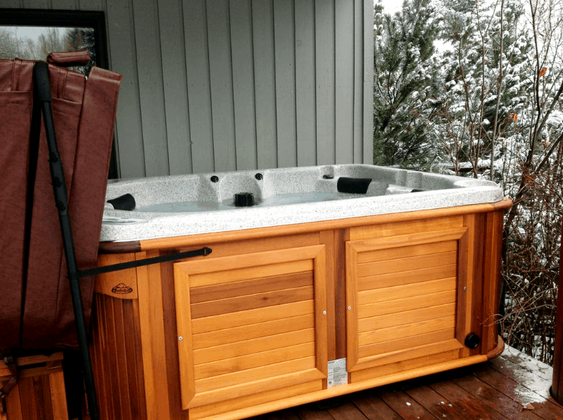 Arctic Spas Hot tub on a deck in winter